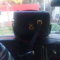 Louis Vuitton Metris Pochette Handbag