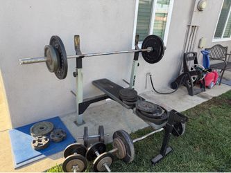 Olympic weights, bench and some dumbbells
