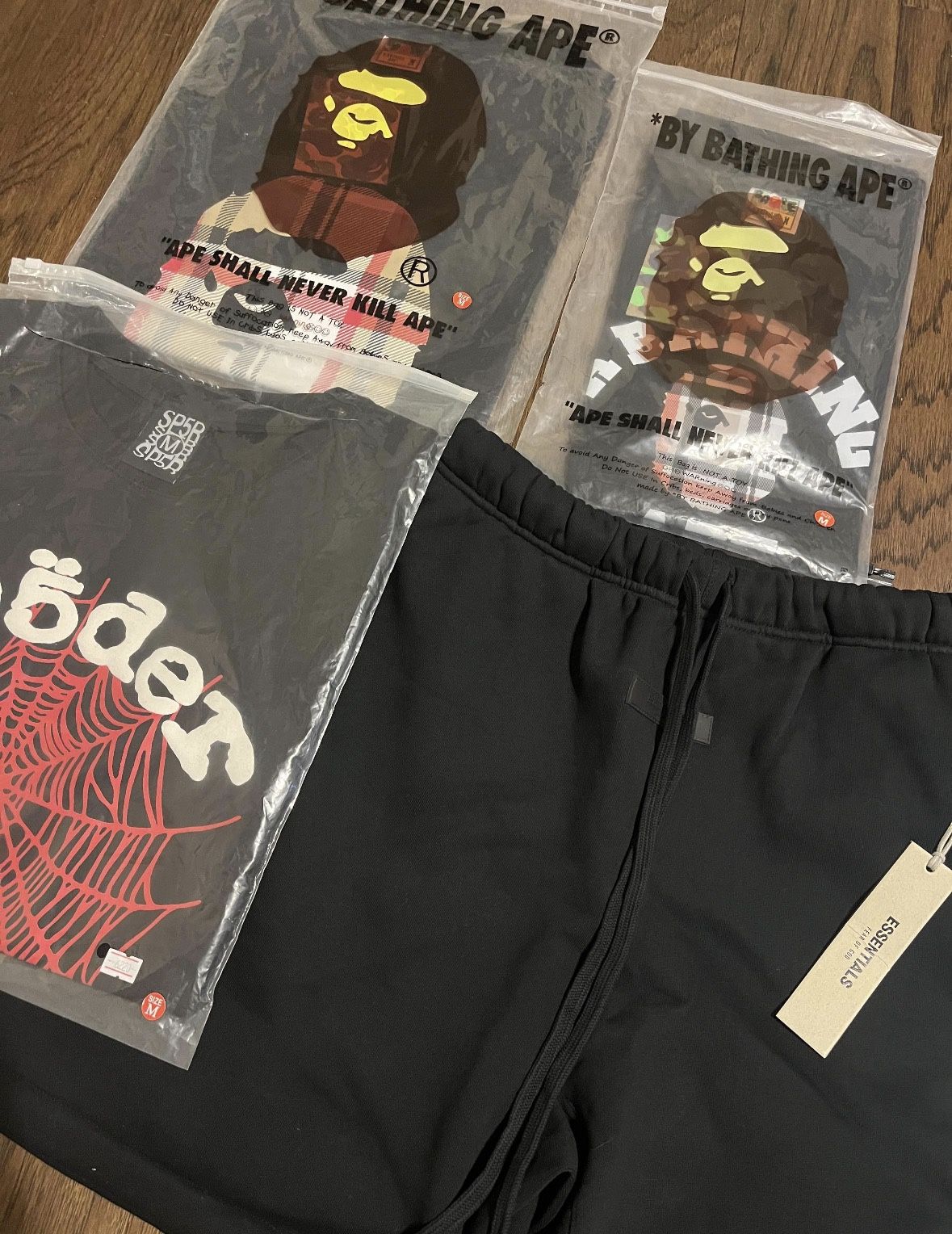 Sp5der tees, Bape tees, essential shorts.