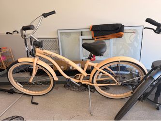 Yellow beach cruiser -baby seat attachment included