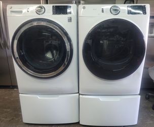 General Electric Super Capacity washer and dryer on pedestals