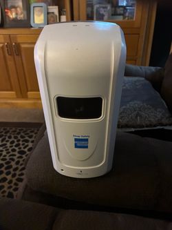 Hand sanitizer dispenser