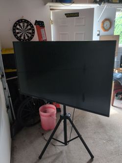 LG 55 inch TV on tripod with lights