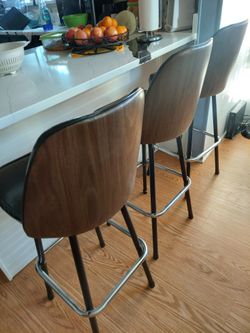 3 Bar chairs black and brown.