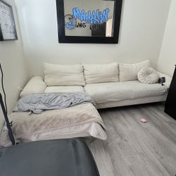 L shaped cream colored couch 
