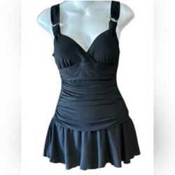 White Stag women’s vintage inspired swimsuit, size Medium, in classic black with gold trim accents. Designed with a ruched waist for a flattering, sli