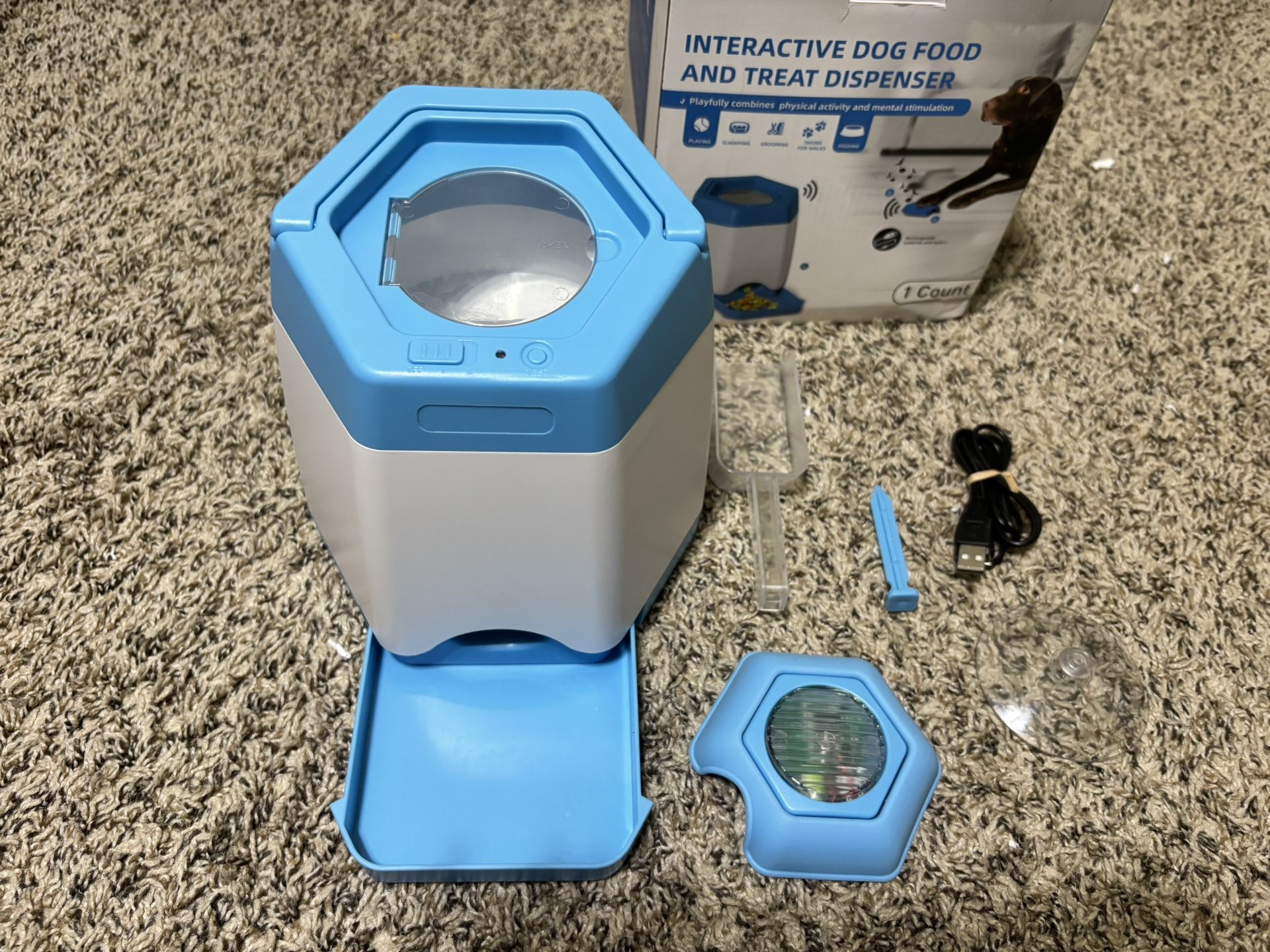 Interactive dog food and treat dispenser