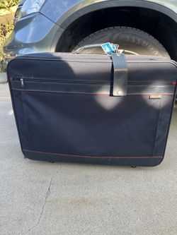 Vintage Rare Black  Rolling Suitcase Soft Side .