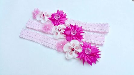 Handmade pink baby girl elastic headband headwrap decorated with beaded fabric flowers for babies 3 mon to 12 mon