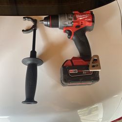 Milwaukee M18 Fuel drill/driver with a 5.0Ah XC battery and the side handle