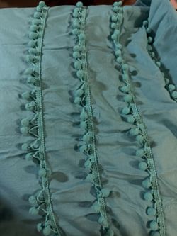 Two panels of blue, a teal turquoise color curtains fully lined