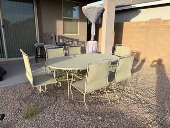 Outdoor table and chairs with cushions