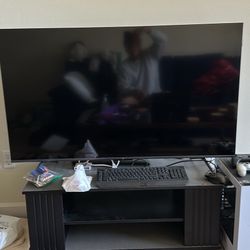 4K TCL 50” Smart TV w/Airplay and TV Stand below it