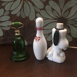 snoopy, bowling pin, and green bell avon bottles good condition $10.00 each 