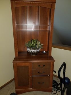 Tommy bahama office book shelf.