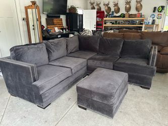 Black sectional couch ottoman