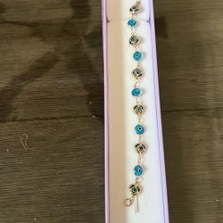 Gold Bracelet With Blue Eyes