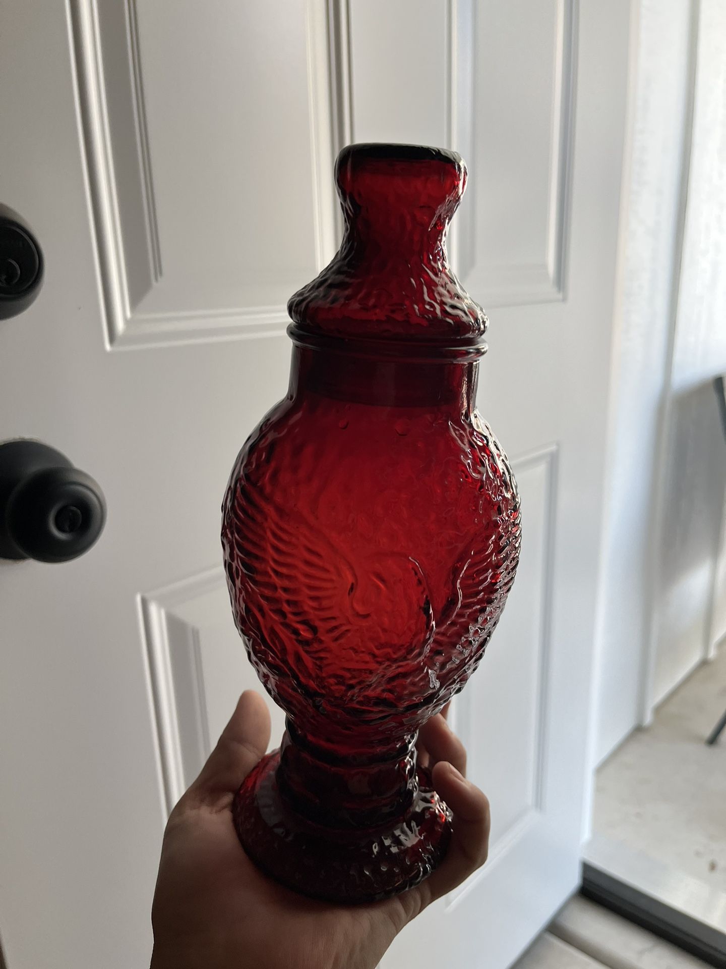 vintage Wheaton ruby red glass apothecary jar with an embossed eagle design.