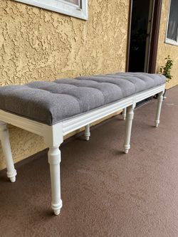 Upholstered white and gray bench