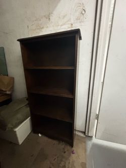 Narrow wooden book shelf