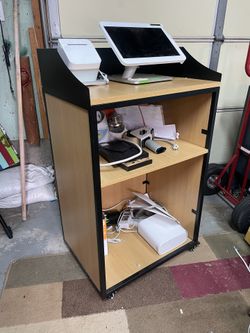 Hostess style checkout counter on wheels.