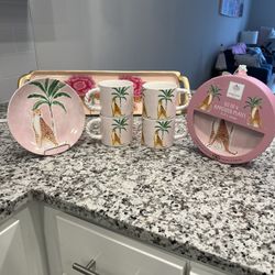 A set of four mugs and four the print is a cheetah and background with a palm trees Appetizer Plates And Four Mugs