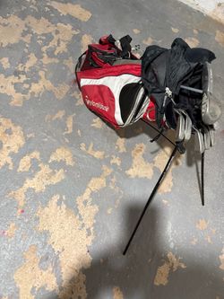 Callaway golf clubs and Taylor Made Golf bag stand bag