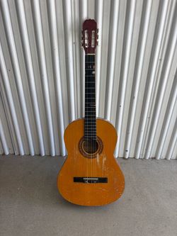 Used acoustic guitar