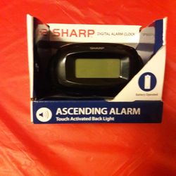 Sharp  Digital  Alarm Clock. 
