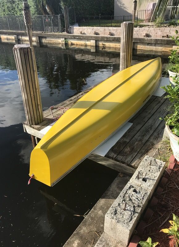 16 foot Indian River flat back canoe with paddles