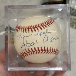 autographed baseball in a display case