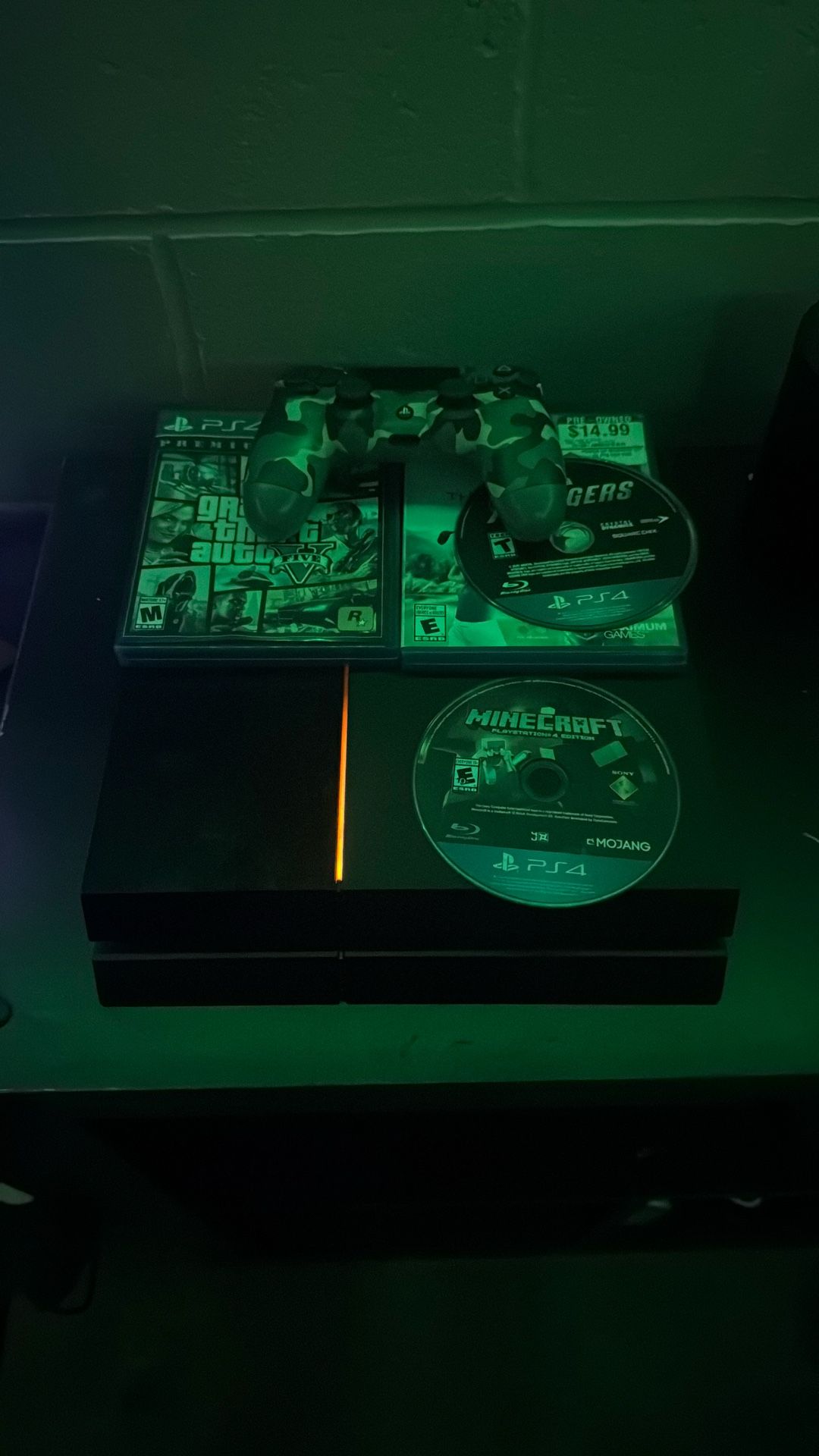PS4, with 1 controller, minecraft, power cord, GTA 5, and 2 other games.