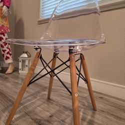 Clear transparent chair, wooden legs