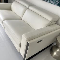 New!!! Power Reclining Loveseat Real Leather, adjustable headrest and footrest. Dimensions 63 W x 33 H x 43.5 L