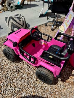 Pink ride-on jeep for kids, perfect for outdoor fun!