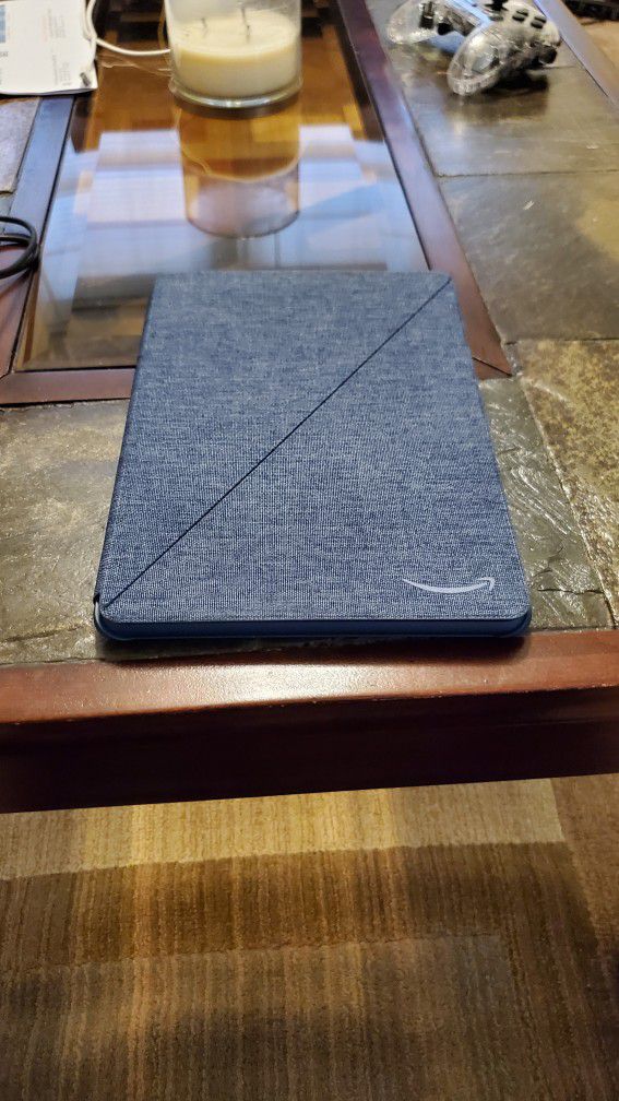 Amazon Kindle Fire HD 10, with denim case.