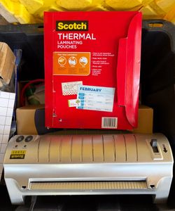 Heated laminator light new with laminated sheets