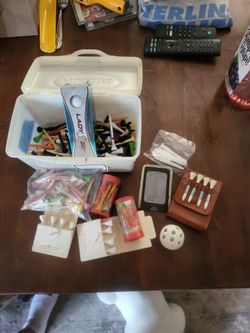 Golf tees and some golf balls