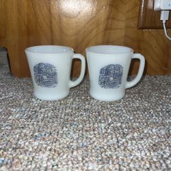 Set of 2 Anchor Hocking Fire King CURRIER & IVES Pattern Mugs. One has a surface crack see pics