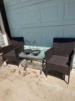 Two patio chairs with table