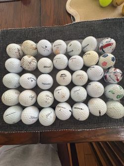35 mixed brands golf balls. Used