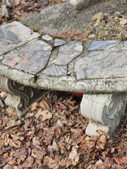 Outdoor concrete bench  has small crack but otherwise it's in good shape