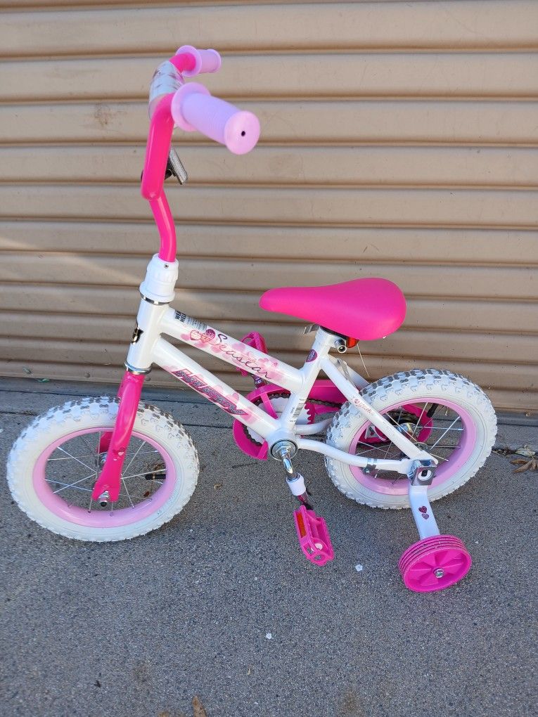 Huffy Seastar Girls Bike With Training Wheels. Like New