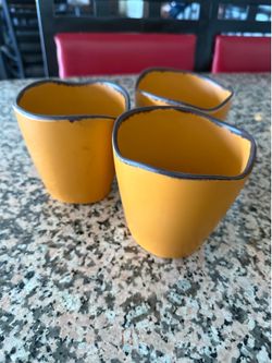 Three mini sauce/dressing crocks