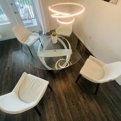 59” Glass Dining Table with Steel Base and 4 matching Genuine Leather Chairs