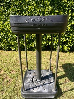 PUG Co. Patio Garden elevated planter. • The planter itself is structurally intact-no obvious cracks or warping. • The white, chalky residue on the ba