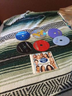 6 dvds movies and 1 music cd for sale
