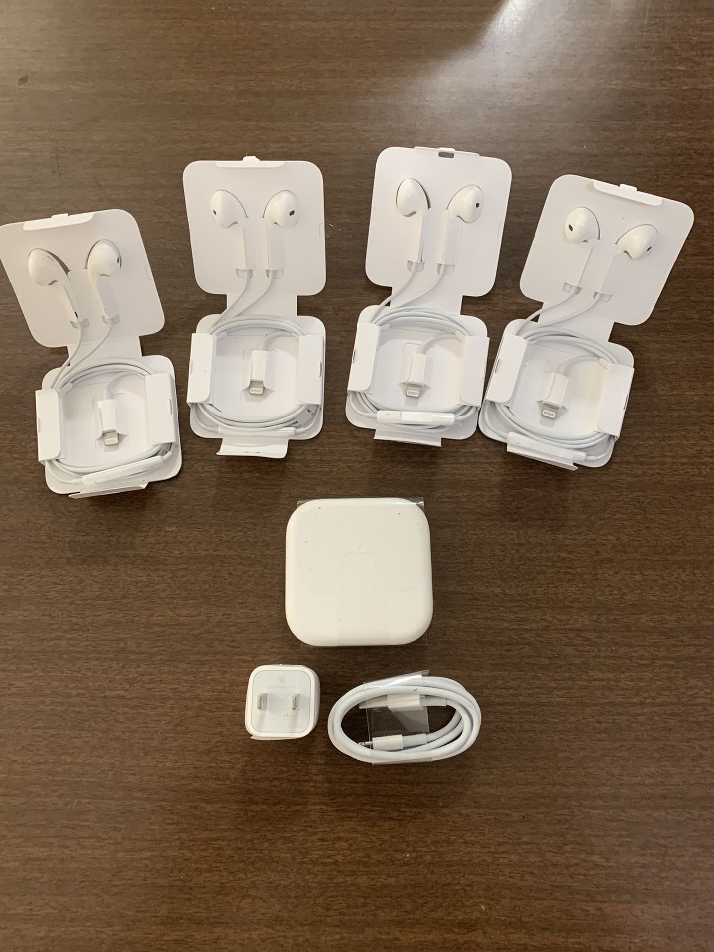 Five pair of iPhone wired headphones $20 each. Plus a wall charger and USB cord for $20.00 One pair of the headphones are for a iPhone seven and olde
