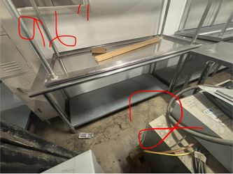 Stainless steel work/ prep tables (2 tables) ($400 each)