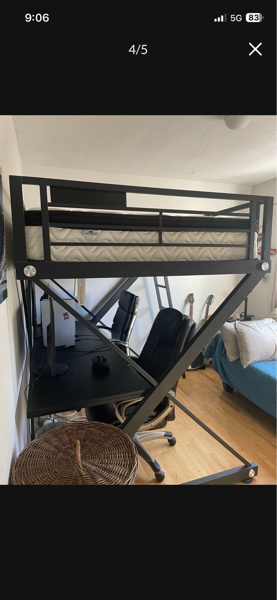 Large elevated bed with desk underneath for small spaces